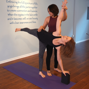 Yoga student in private session with yoga instructor